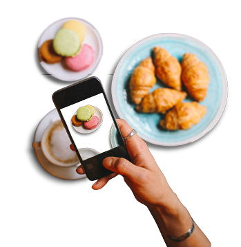 Vintage toned image of a young woman sitting in the cafe, having espresso coffee, French croissants and some sweet macarons  Relaxing and enjoying the moment in the afternoon 
